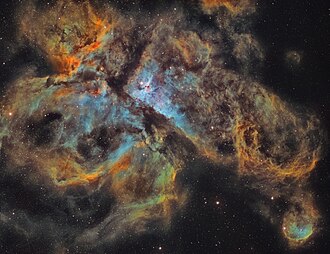 Emission-line filtered image of the Carina Nebula, photographed using a modified version of what is known as the Hubble palette